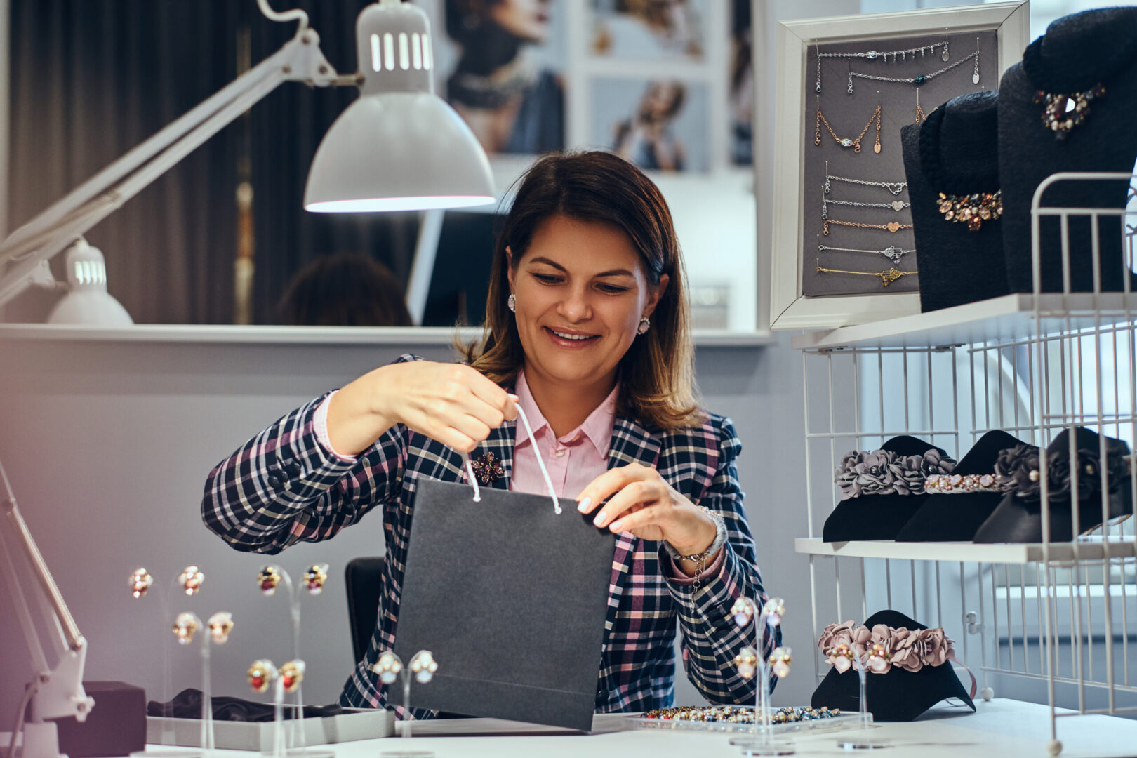 portrait happy elegantly dressed woman seller packs precious earrings box her client luxury jewelry store scaled